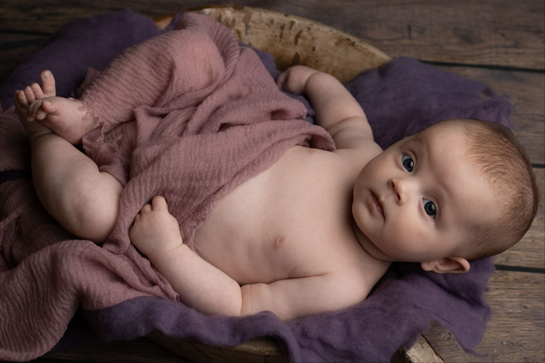 Baby girl wide awake during a newborn photoshoot
