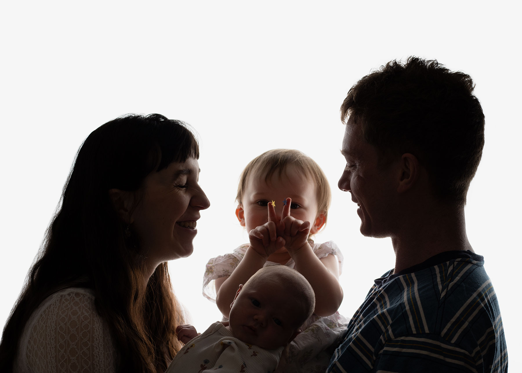 Mother, father and two children having a happy moment together during family photoshoot