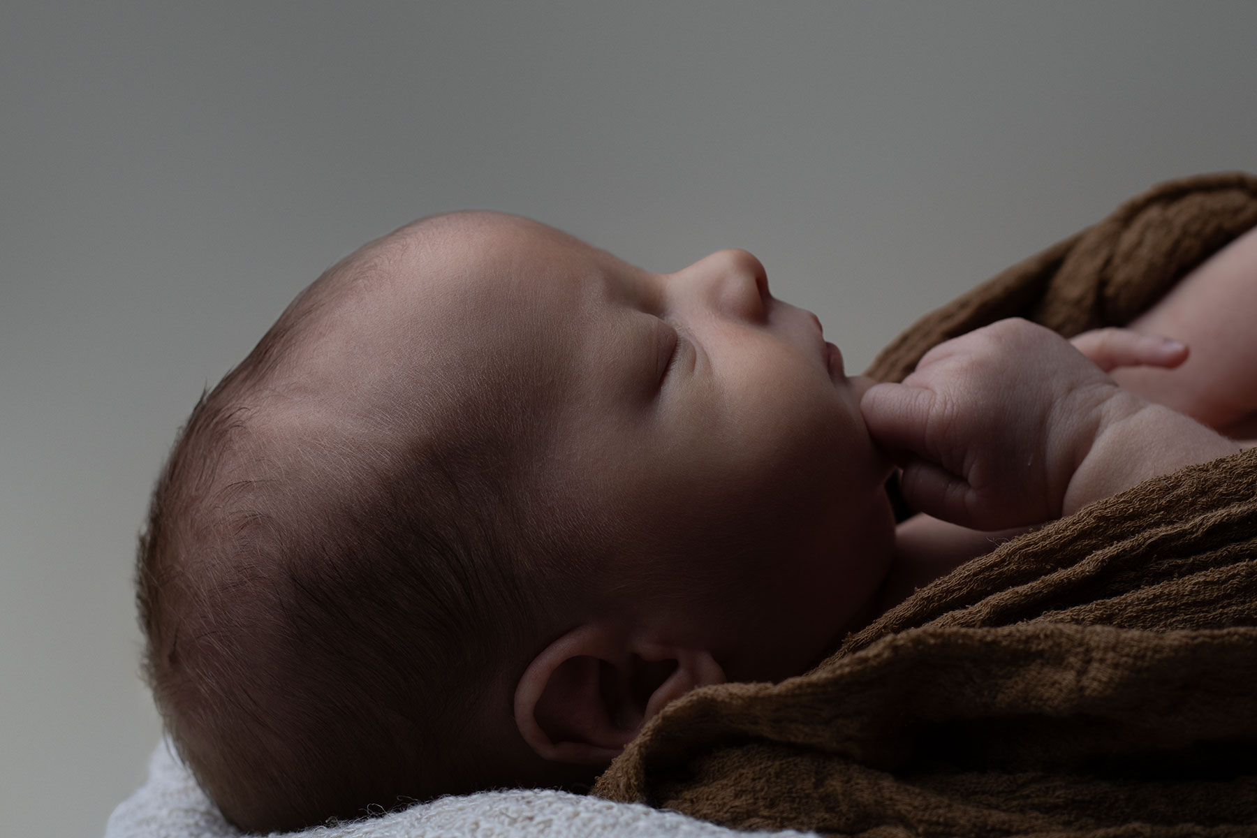 Side profile of a newborn baby boy