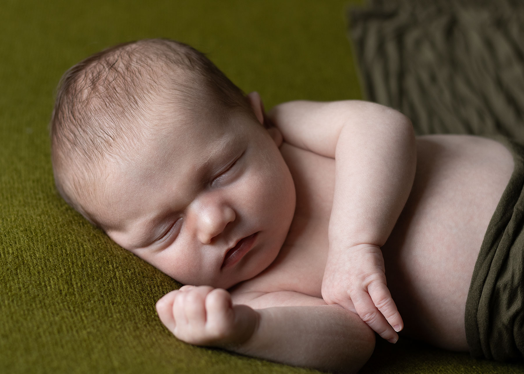 Relaxed baby during newborn photoshoot