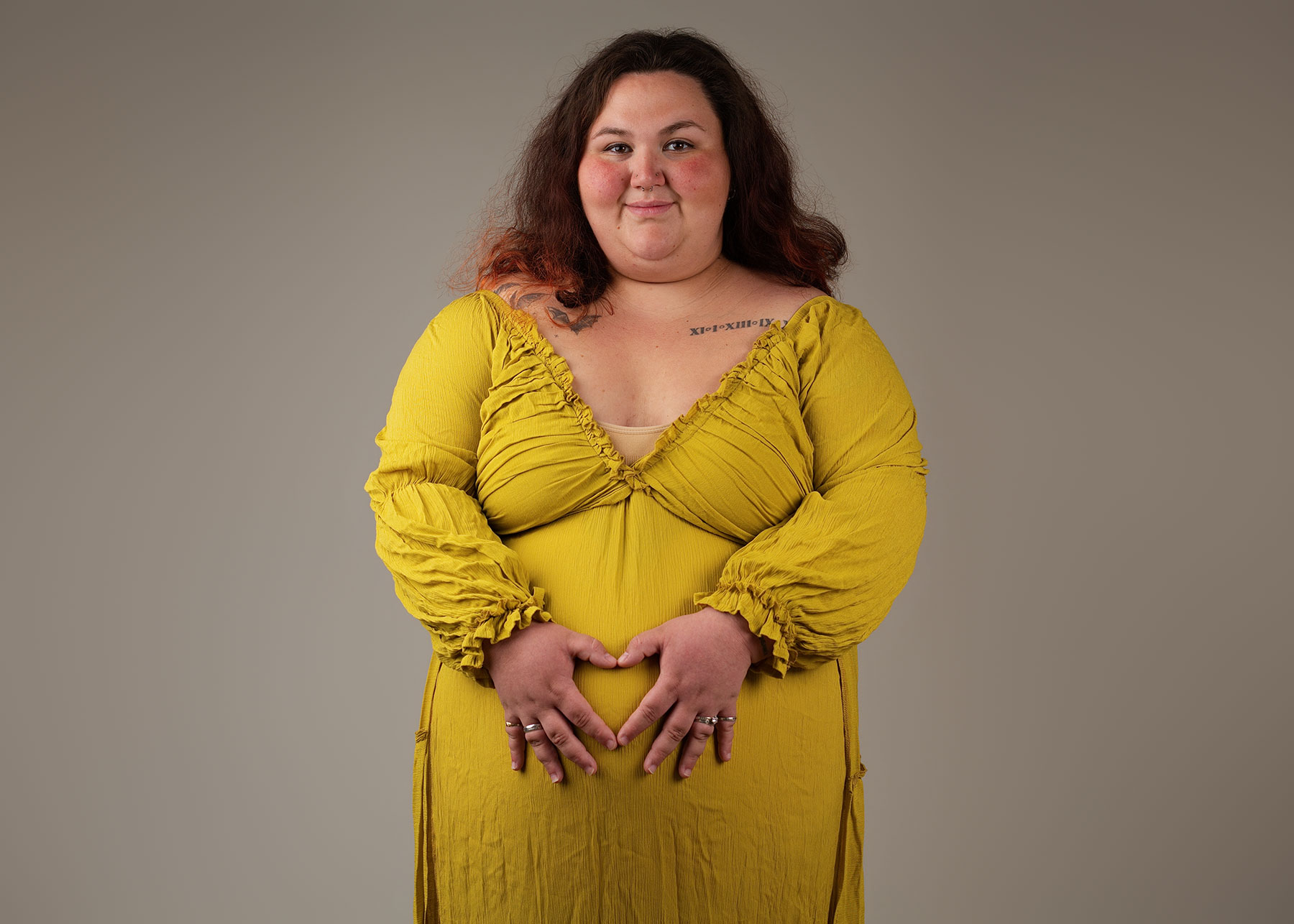 Pregnant woman enjoying her maternity photoshoot